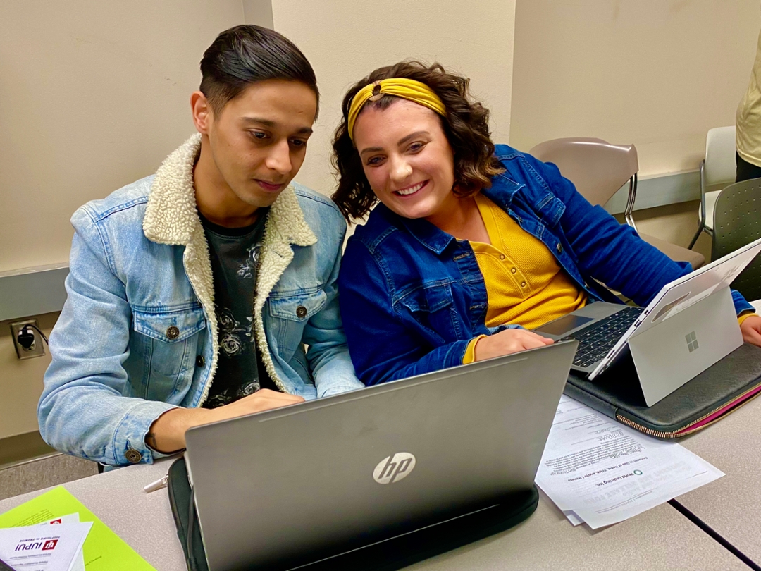 Two students participating in a coding session