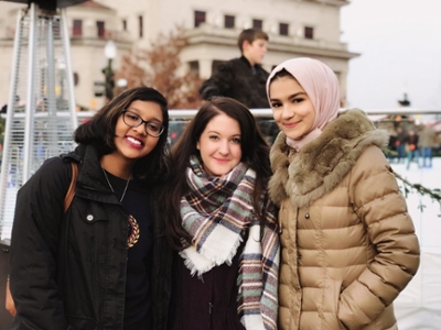 three IPMP participants at an event